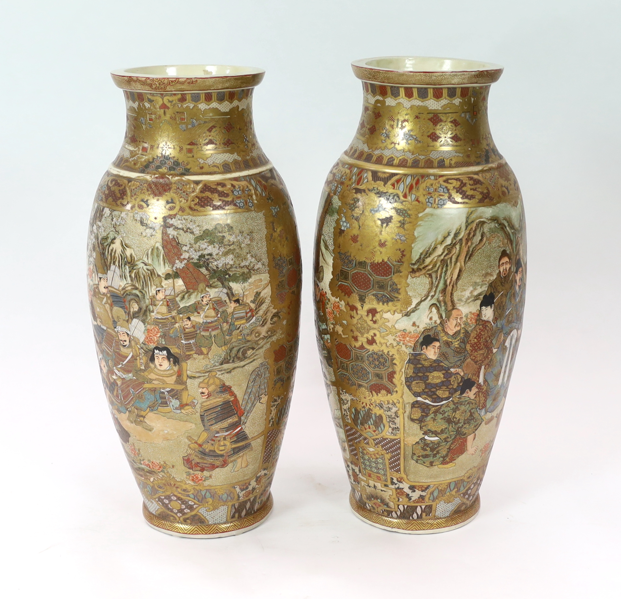 A pair of large Japanese Satsuma pottery 'Samurai' vases, Meiji period, one vase restored